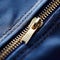Close up of zipper on blue jacket, AI