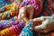 Close-ups of hands knitting or crocheting with vibrant yarn