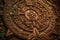 Close view of the ancient Aztec mayan calendar with round pattern and relief on stone surface created by generative AI