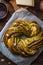 Close view Babka Brioche Wreath with Pesto and Parmesan