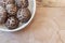 Close view of bowl of shiitake mushrooms on a weathered wood table, copy space