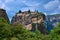 Close view of clifftop Eastern Orthodox monastery of Holy Trinity or Agia Triada in famous Meteora valley, Greece