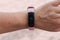 Close view of fitness tracker on wrist of female. Active living concept