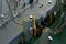 Close view on fuel hose of bunker barge on crane connected to container vessel in bunker station.