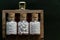 Close view of homeopathy medicine bottles of pills in wooden old box on dark background - classic Homeopathy concept