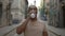 Close view of the male runner drinking water after jogging. Man feels thirsty and drinks water after running. Sport and