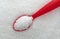 Close view of margarita salt with a red spoon