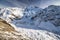 Close view of Mount Cook`s Caroline face from Ball Pass trek. Massive glacier, rocks, snow and avalanches
