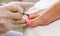 Close view of nails and feet with nail file.