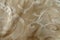 Close view of old-fashioned beige damask jacquard fabric