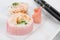 Close View of Pink Sushi and Chopsticks
