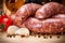 Close view of raw pork thick sausages on cutting board