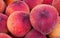 Close view of red-ripe peaches at market, Valencia