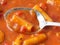 Close view of rigatoni pasta and sausage with a spoon top view