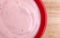Close view of strawberry yogurt in bowl