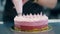 Close view three-layer cake decorated ream using pastry bag