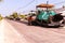 Close view on the workers and the asphalting machines, Workers making asphalt at road construction