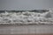 Close of water wave with reflection on marina beach, chennai, beaches of India