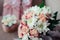 Close wedding bouquet of white chrysanthemums, in daylight