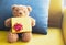 Close â€“ up teddy bear. Teddy bear and yellow gift box with Pillow.