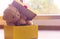 Close â€“ up teddy bear. Teddy bear in yellow gift box beside window