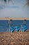 Closed beach cafe with blue chairs