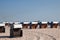 Closed beach chair huts on white sand beach in Warnemunde German