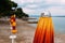 Closed beach parasol at empty seaside coast in Crikvenica, Croatia