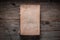 Closed book on vintage wooden background.  Old book on the wooden table. Closed book with empty cover laying on wooden table