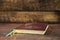 A closed book on a wooden table. Bible on wooden background