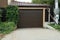 Closed brown gate on the facade of a private garage