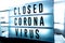 Closed businesses for CoronaVirus pandemic outbreak, closure sign on retail store window banner background. Government shutdown of