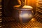 Closed ceramic pot in illuminated electric oven