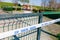 Closed children playground due to corona virus pandemic, with white tape across the gate