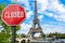 Closed, close stop sign with Eiffel tower background in Paris, France