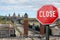 Closed, close stop sign with view of Spain square in Barcelona, Spain