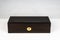 Closed dark brown wooden hardwood luxury jewelry watch case box with lid on white background.