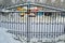 Closed gates of amusement park in winter