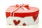 Closed heart shaped gift box with a ribbon