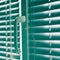 Closed horizontal blinds with rope and handle. Green tone