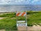 Closed La Jolla Beach with informative signage during COVID-19 pandemic.