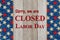 Closed Labor Day sign with USA stars banner