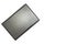 Closed laptop on a white background. View from above. The laptop lies sideways in the upper left corner. Black, graphite, gray,