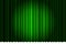 Closed luxury green curtain with many shadow stage background spotlight beam illuminated. Theatrical fabric drapes stage