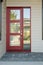 Closed modern red exterior door of a home