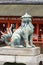 Closed mouth lion at itsukushima Shinto Shrine.