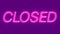 Closed neon sign appear on violet background.