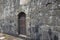 Closed Old metal, iron Door In A Wall. Doorway of a thirteenth century medieval castle