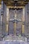 Closed ornate decorative brass door with locks