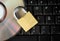 Closed padlock, keyboard and DVD - data security